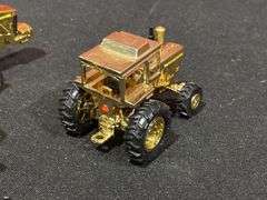 (4) 1/64 John Deere Gold Tractors Ertl