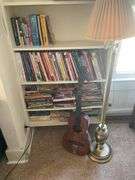 Books, Floor Lamp, and Old Guitar