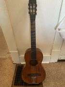 Books, Floor Lamp, and Old Guitar