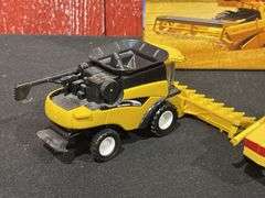 (3) 1/64 New Holland Combines