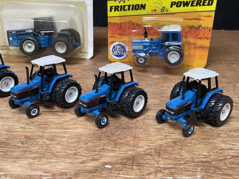 (7) 1/64 Ford Tractors