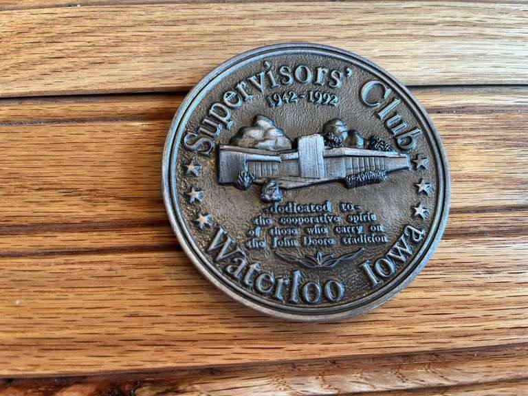(2) John Deere Medallions