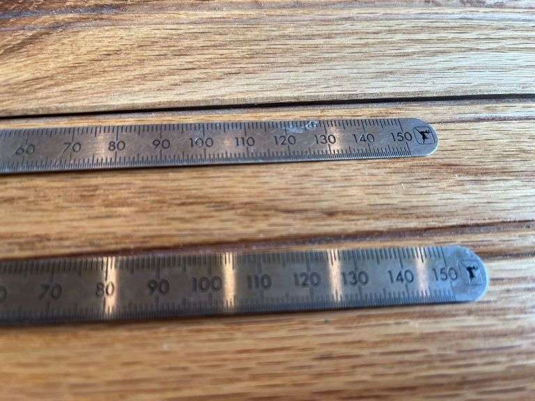 (2) John Deere Metal Rulers