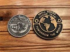 (2) John Deere Medallions
