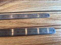 (2) John Deere Metal Rulers
