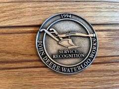 (2) John Deere Medallions
