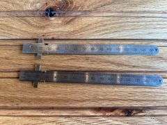 (2) John Deere Metal Rulers