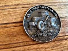 (2) John Deere Medallions