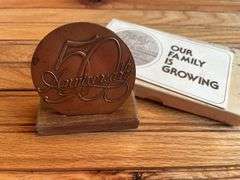 (2) John Deere Medallions