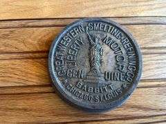 (2) Babbitt Metal Paperweights