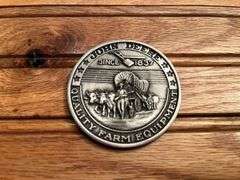 (2) John Deere Medallions