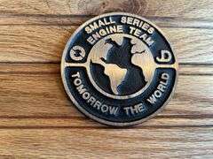 (2) John Deere Medallions