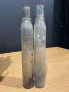(8) Pure Oil Tiolene Embossed Glass Oil Bottles with (2) Carriers