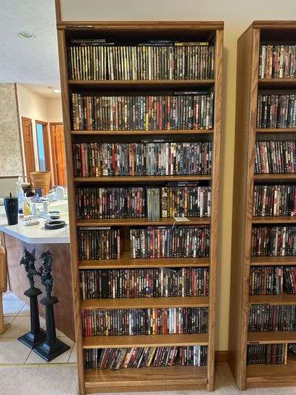 Bookshelf and DVD’s alphabetically organized DVDs letter A through letter M. 84” T x 33” W image