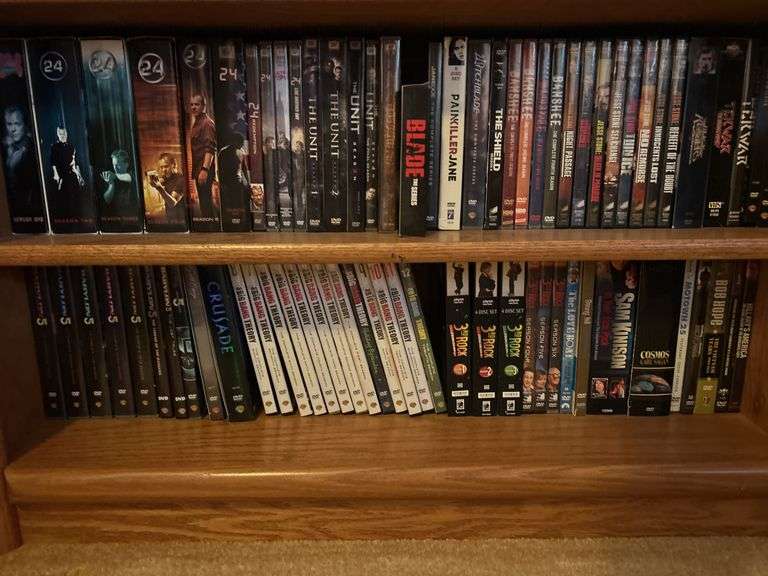Bookshelf and DVD’s, Small Boombox -  (assorted DVD's)  The shelf is 82” tall by 36” wide.