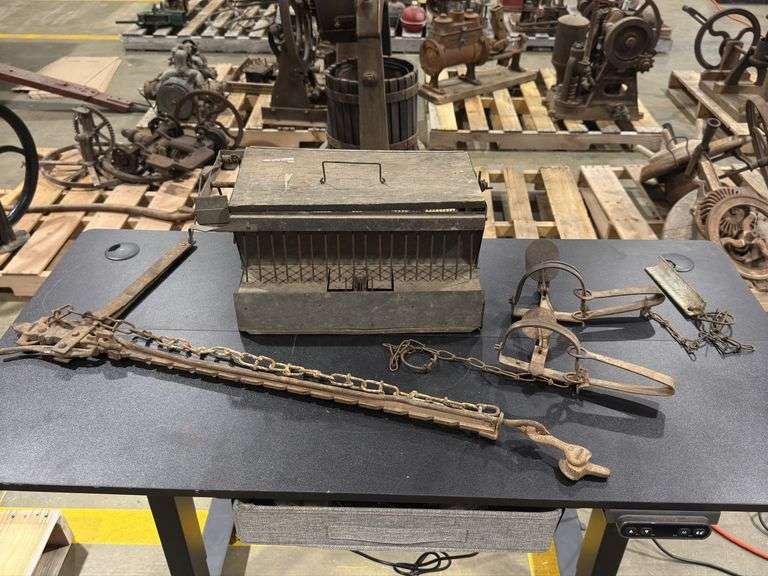 Fence and Trap. Three traps and a Barb Wire fence Stretcher. image