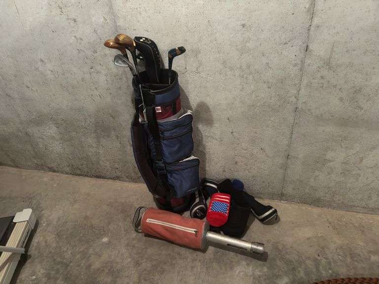Golf Bag along with clubs and head covers image