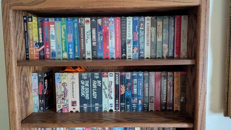 Bookshelf and Contents (Assorted VHS Movies) 72” T x 30” W