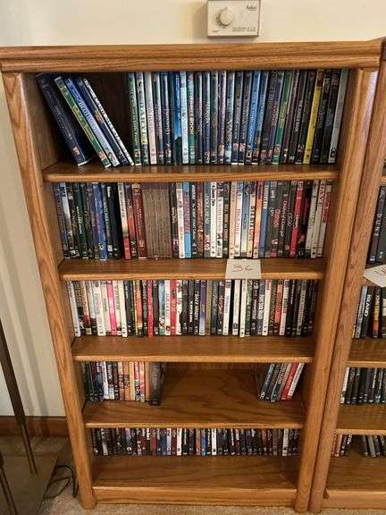 Bookshelf and DVD’s (assorted DVD's)  The shelf is 82” tall by 36” wide. image