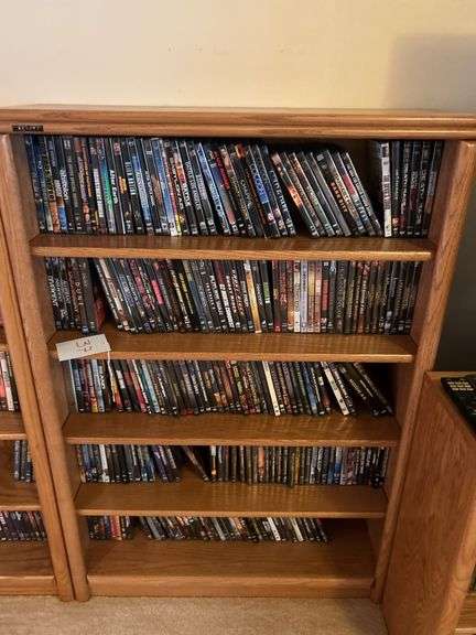Bookshelf and DVD’s  (assorted DVD's)  The shelf is 82” tall by 36” wide. image