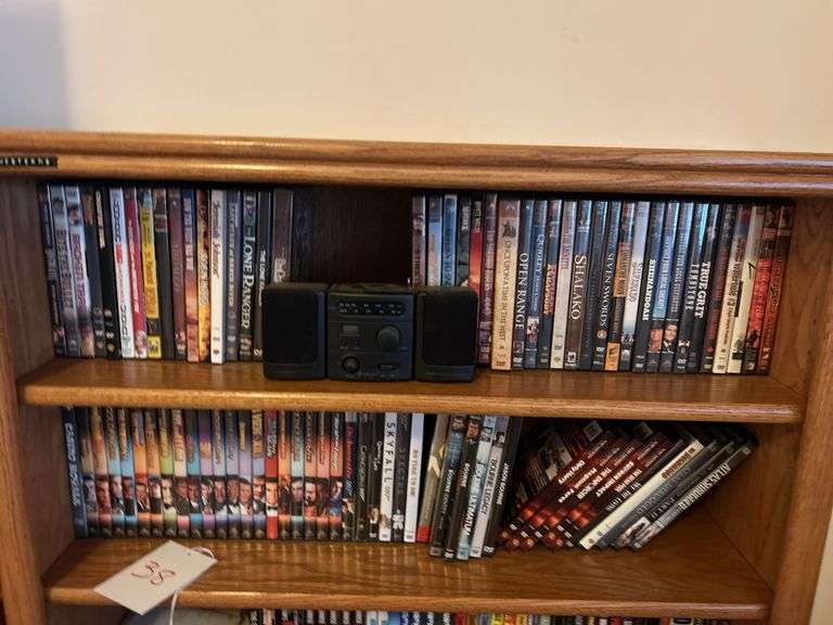 Bookshelf and DVD’s, Small Boombox -  (assorted DVD's)  The shelf is 82” tall by 36” wide.