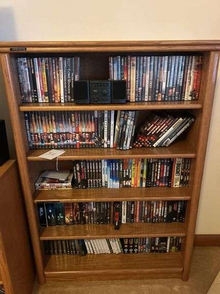 Bookshelf and DVD’s, Small Boombox -  (assorted DVD's)  The shelf is 82” tall by 36” wide. image