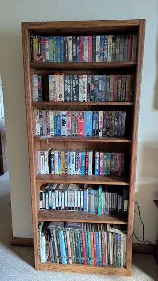 Bookshelf and Contents (Assorted VHS Movies) 72” T x 30” W image