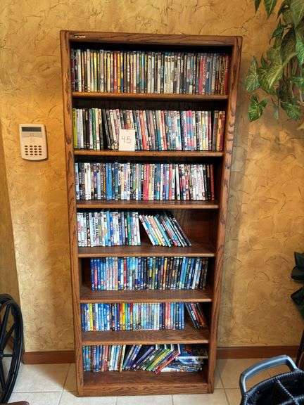 Bookshelf with DVDs -  (assorted DVD's)  The shelf is 82” tall by 36” wide. image