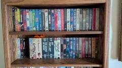 Bookshelf and Contents (Assorted VHS Movies) 72” T x 30” W