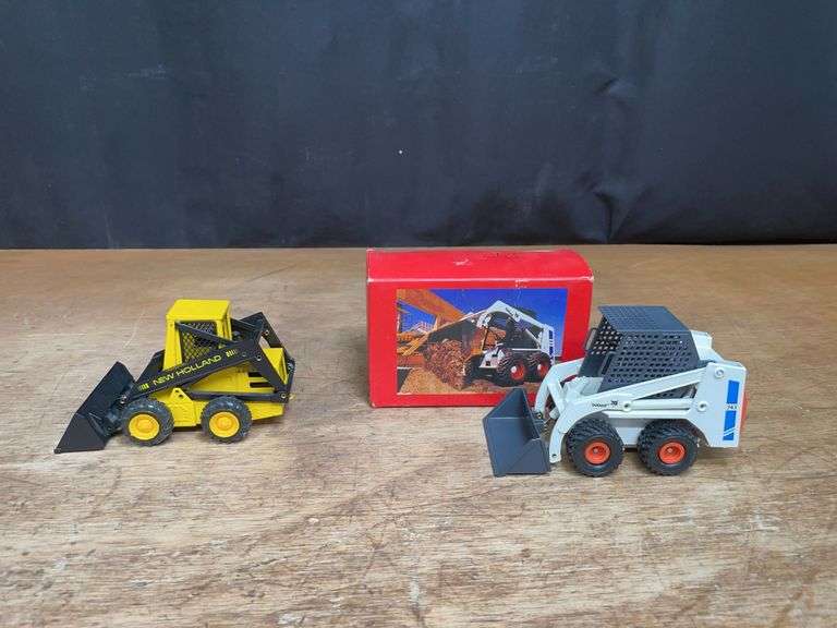 (2) New Holland + Bobcat Skid Steer Loaders image