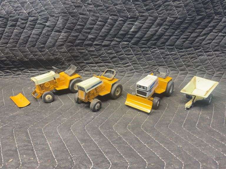 (4) 1/16 Cub Cadets and Garden Cart Ertl image