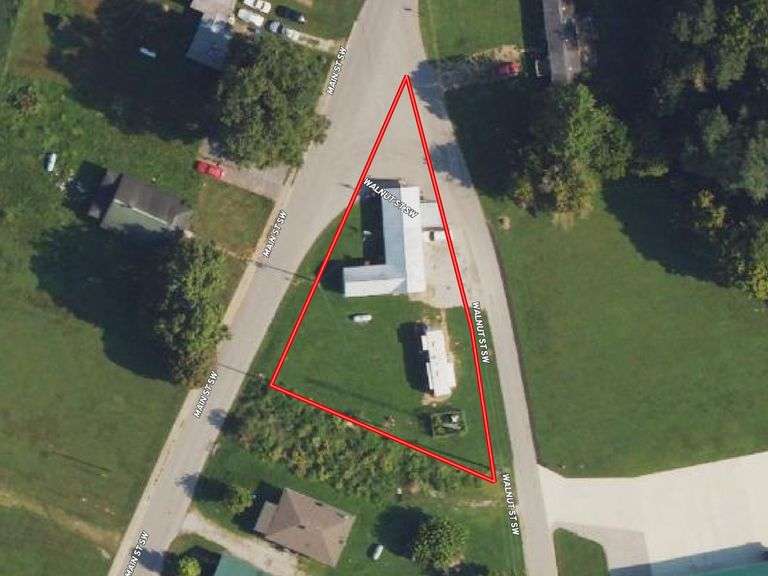 TRACT #1 (12010 Main St SW, Mauckport, IN): 0.325 ac corner lot with 1326 SF former postal building.