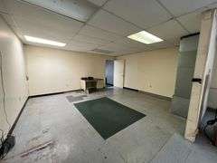 TRACT #1 (12010 Main St SW, Mauckport, IN): 0.325 ac corner lot with 1326 SF former postal building.