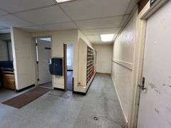 TRACT #1 (12010 Main St SW, Mauckport, IN): 0.325 ac corner lot with 1326 SF former postal building.