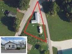 TRACT #1 (12010 Main St SW, Mauckport, IN): 0.325 ac corner lot with 1326 SF former postal building.