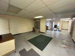 TRACT #1 (12010 Main St SW, Mauckport, IN): 0.325 ac corner lot with 1326 SF former postal building.