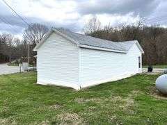 TRACT #1 (12010 Main St SW, Mauckport, IN): 0.325 ac corner lot with 1326 SF former postal building.