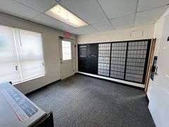 TRACT #1 (12010 Main St SW, Mauckport, IN): 0.325 ac corner lot with 1326 SF former postal building.