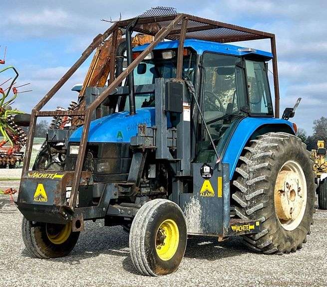 New Holland TS110 Tractor with Alamo Machete Hydraulic Boom Mower image