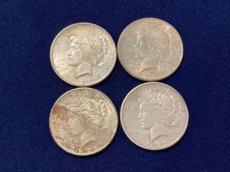 Four 1923-S Peace dollars, circulated image
