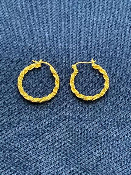 One 14K and one 10K earring image
