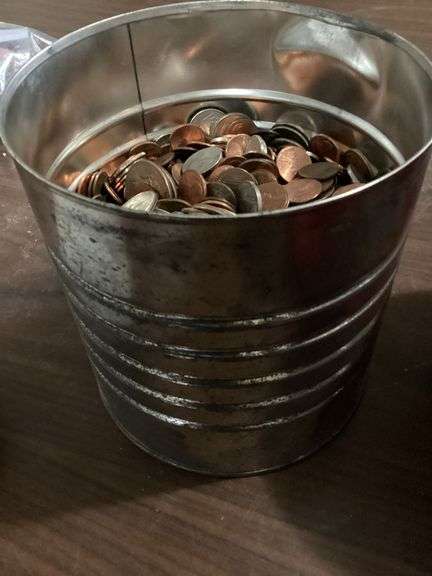 Big coffee tin nearly full of change image