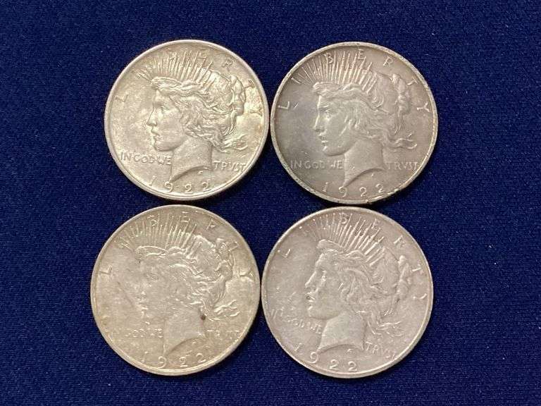 Four 1922-D Peace dollars, circulated image