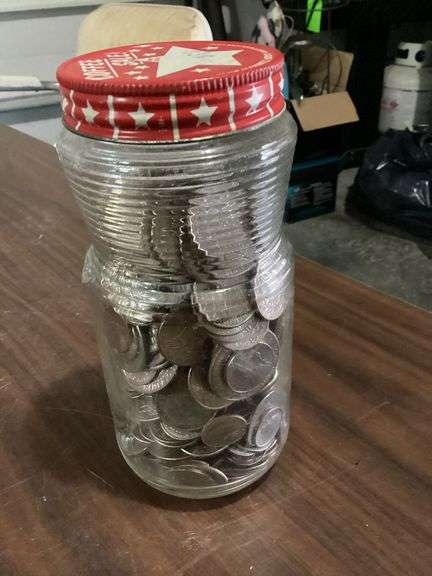 7" jar nearly full of big change image