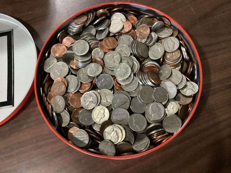 8" diameter candy tin full of change image