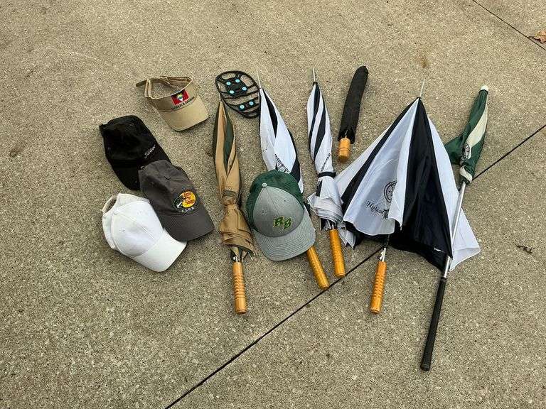 Umbrellas and ball caps image