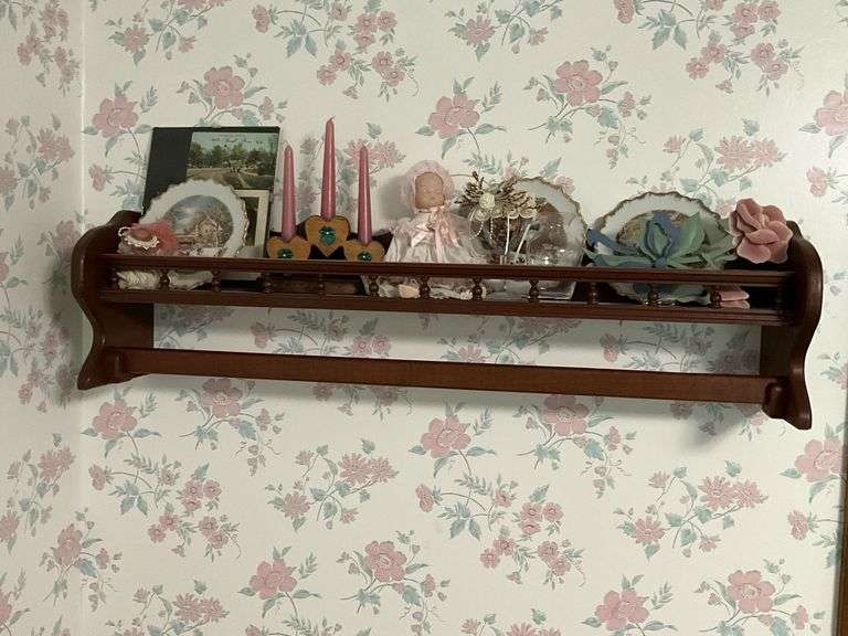 Hanging quilt rack with shelf and contents image