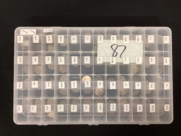 Collection of U.S. State quarters in plastic carrier image