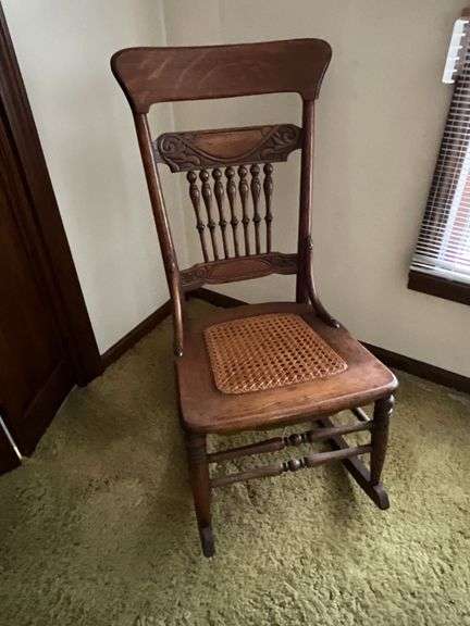 Woven bottom antique rocking chair image