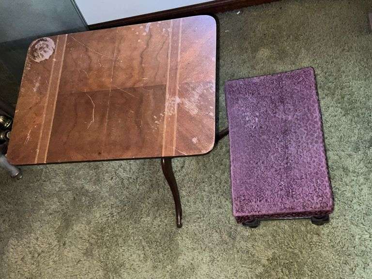 Small end table with water damage to top and upholstered foot stool image